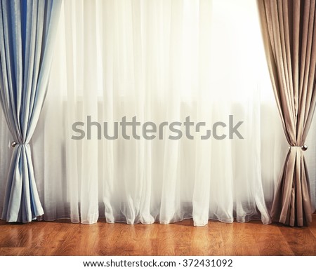 Empty room with curtain and window