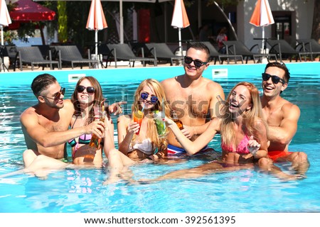 Young people having fun in the swimming pool