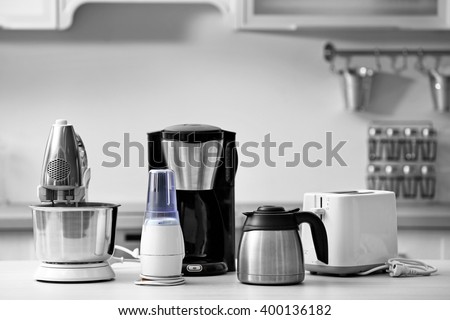 Household and kitchen appliances on the table in kitchen