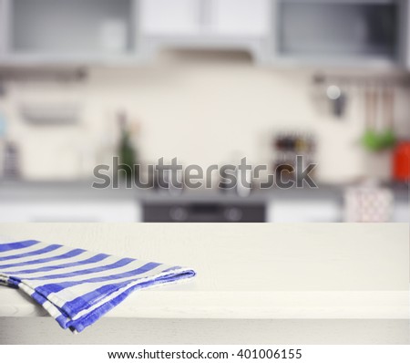 Wooden table and blurred kitchen background