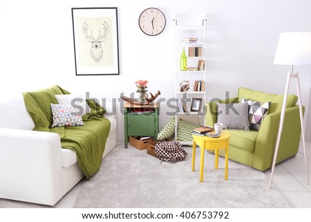 Interior of living room with couch and armchair