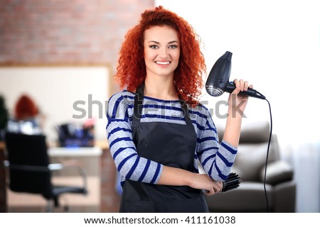 Professional hairdresser with hairdryer