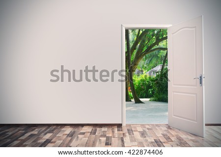 Open door leading to tropical garden