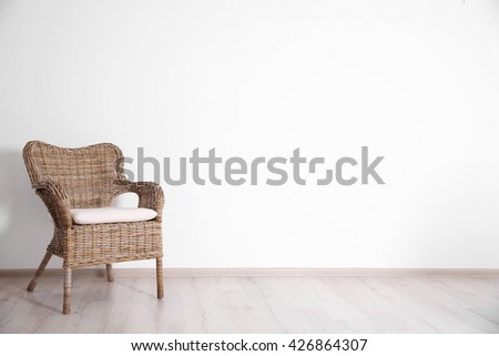 Cozy chair on wall background