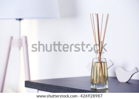 Handmade reed freshener on commode in living room, close up