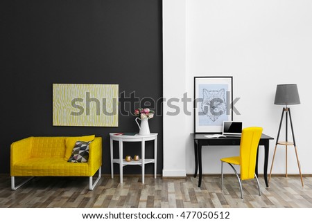 Modern room interior with stylish furniture and fresh roses on table