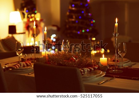 Close up view of table served for Christmas dinner, on blurred background