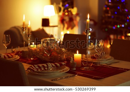 Close up view of table served for Christmas dinner, on blurred background