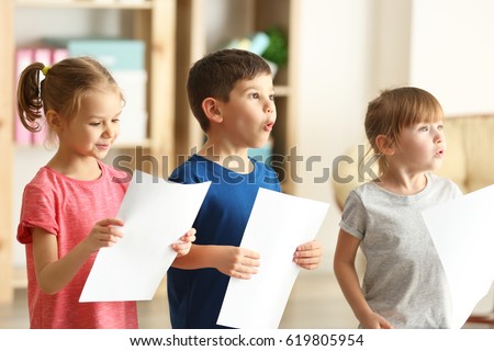 Cute kids singing in music class