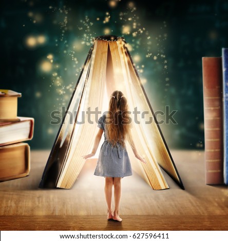 Adventure story and fairy tale. Tiny girl and book with magic glowing on table