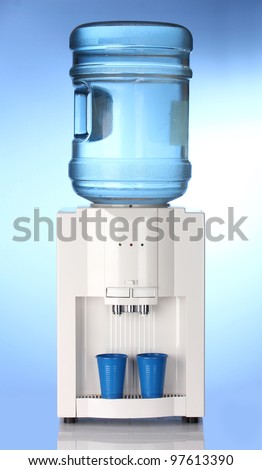 Electric water cooler on blue background