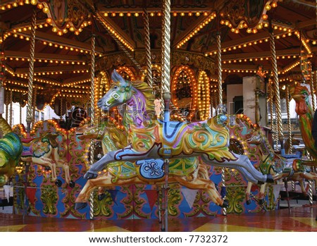 An old style carousel with painted wooden horses
