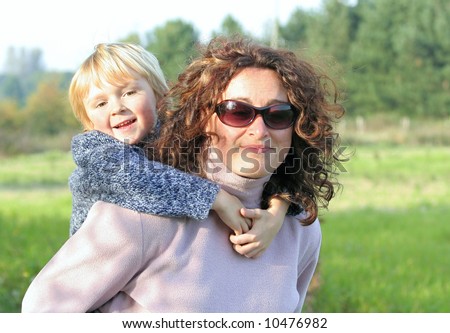 A mother and child having fun in the sun