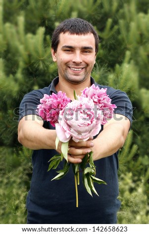 Man with flowers peony
