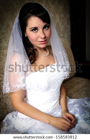 Modest bride woman with wedding makeup and hairstyle