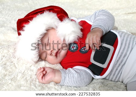 Santa sleeping newborn