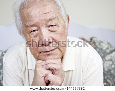 portrait of a sad asian senior man.