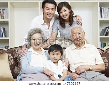 Portrait Of A Three-Generation Asian Family.