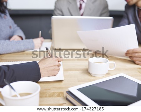 business people reviewing sales performance in a meeting.