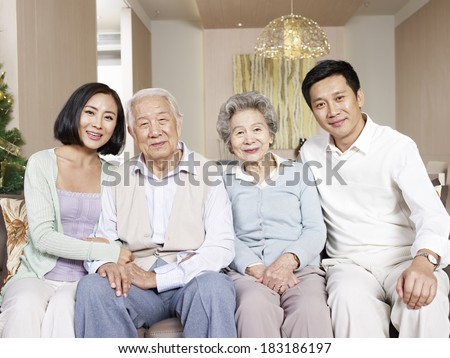 home portrait of a happy asian family