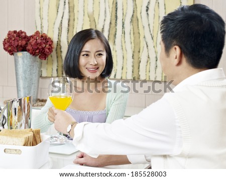 husband and wife toasting