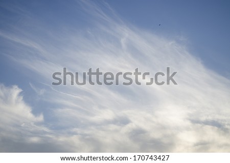 Cumulus clouds and veils