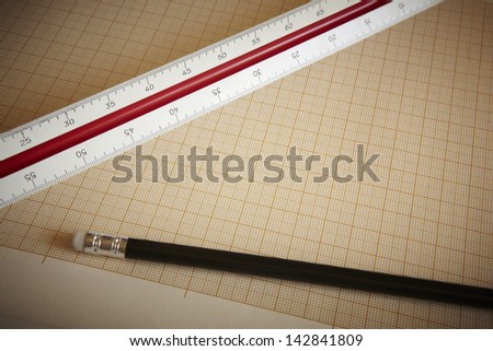 Ruler and pencil with graph paper horizontal composition