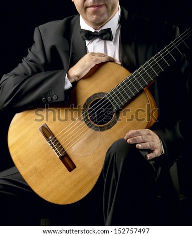 Classical Guitarist low key image square format Unrecognizable person