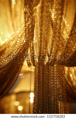 Long and wide chain curtains gold tone vertical