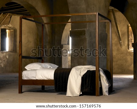 Four poster bed inside old historic building