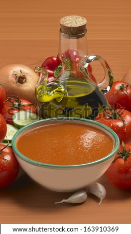 Bowl of gazpacho as done in Spain with ingredients tomato and other vegetables cold food very popular specially in summer