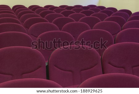 Cinema interior with comfortable red chairs. Horizontal.