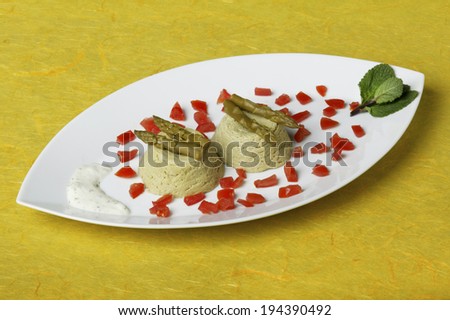 Tuna and asparagus salad served in a fish shaped dish. Horizontal