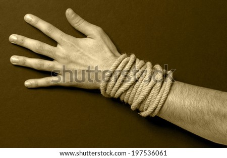 Man with a rope in his hand. Sepia tone. Horizontal