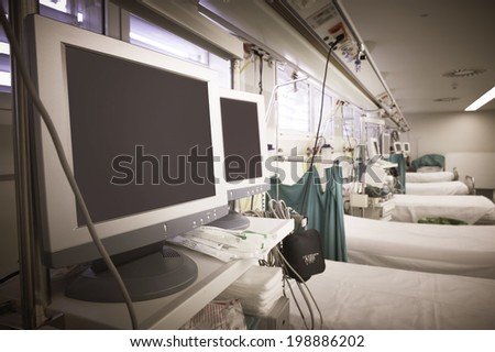 Hospital emergency room with equipment and beds. Horizontal