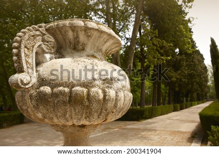 Antique marble pots in a garden. Sepia tone. Horizontal format
