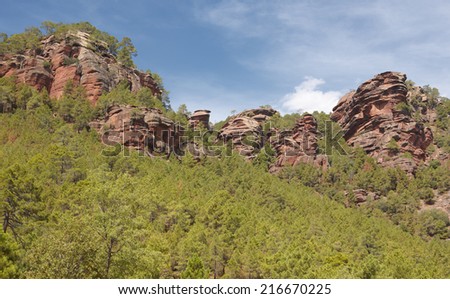 Landscape with huge rocks and pine tree forest in Spain. Horizontal