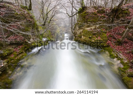 Landscape with waterfall in autumn time in Navarra, Spain. Horizontal