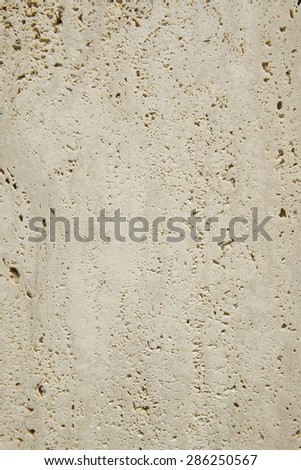 Travertine marble surface detail in vertical format. Indoor