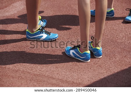 Jumping sport shoes in the athletic field ground. Horizontal