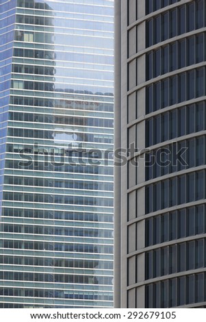 Modern metallic and glass building facades in financial area. Vertical