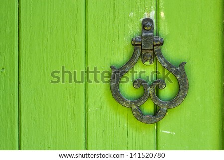 Old knocker on the green door