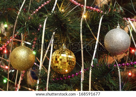 Christmas decorations: three spheres set on the fir tree