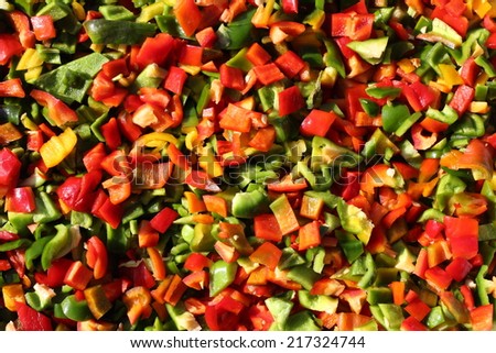 Fresh cut red, green and yellow pepper mix photo
