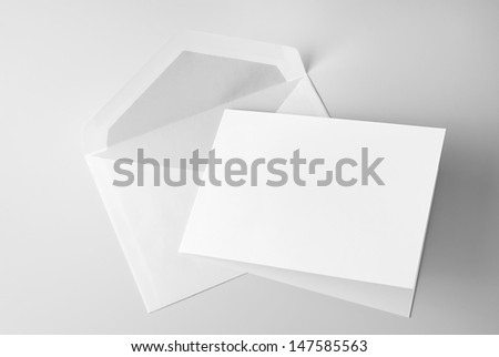 Blank stationery: card and envelope over grey background with shadow