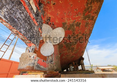 Ship waiting for repairs on a dry dock ,Two-blade propeller, made Ã?Â¢??Ã?Â¢??of brass on the stocks