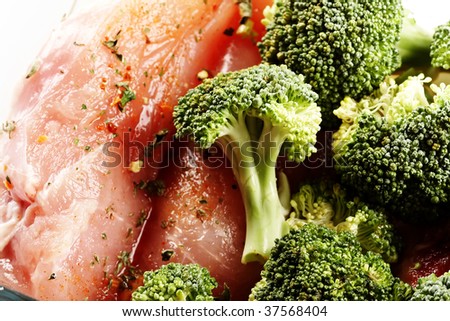 Fresh chicken meat and raw broccoli ready for cook