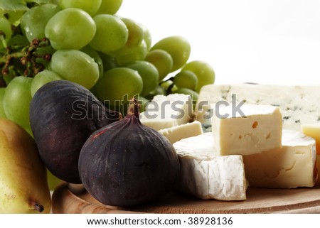 Various types of cheese and fruits