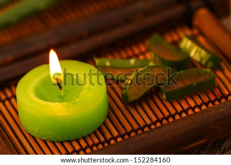 Green candle and aloe vera