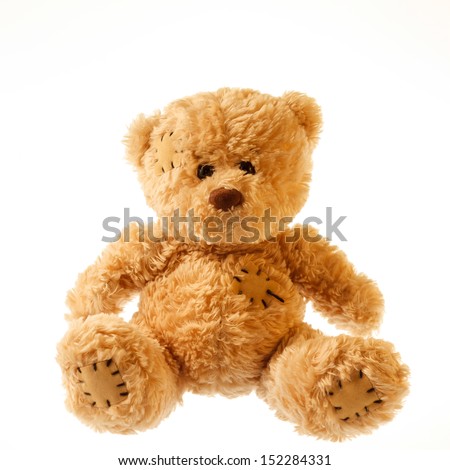Old patched brown teddy bear isolated on white Old patched brown teddy bear isolated on white